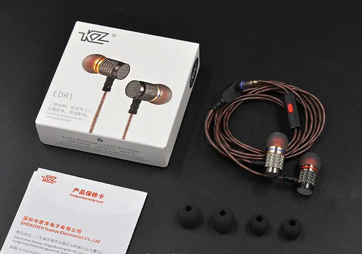 Black wired in-ear headphones with silicone cable, 3.5mm L-bend plug, and TPE eartips.