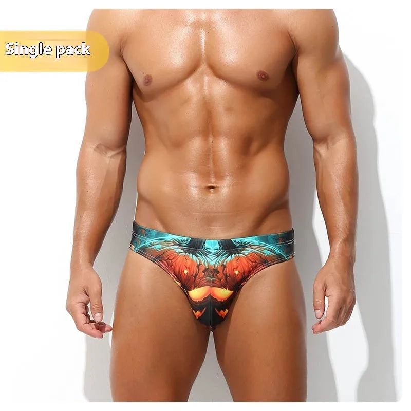 Men's low-waisted quick-drying briefs with digital print design on polyester fabric.