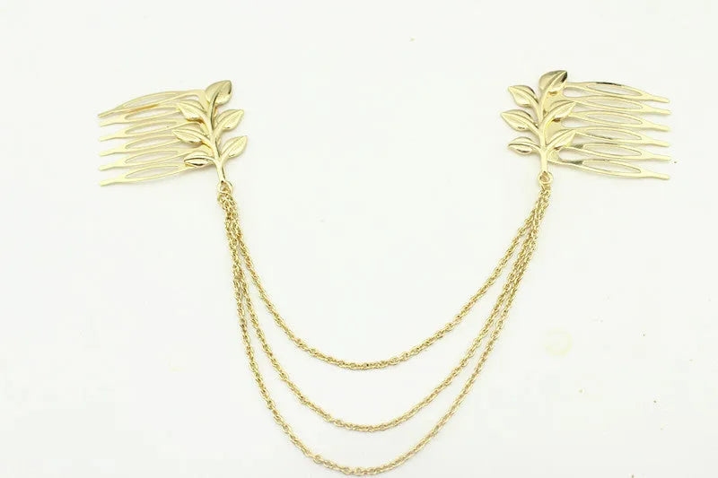Gold leaf chain tassel hair comb on dark background, alloy plated finish