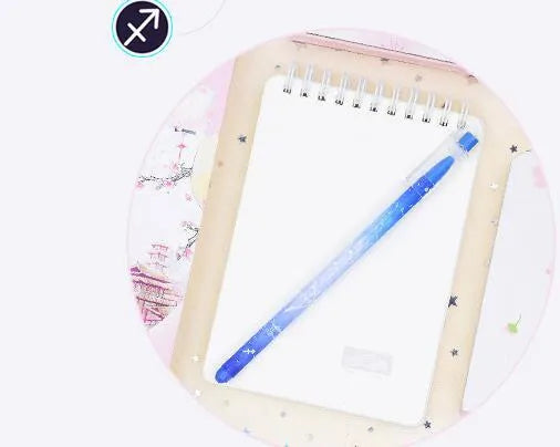 Box of 12 plastic gel pens with quick-drying ink and constellation-themed designs in assorted colours