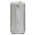 Waterproof portable Bluetooth outdoor speaker in black, camouflage, grey, or red colours.