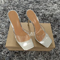 Women's black and silver high heel boots with a PVC sole, shown in multiple adult sizes.
