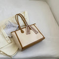 Soft PU commuter shoulder bag showing open pocket, internal phone compartment, and zippered change section