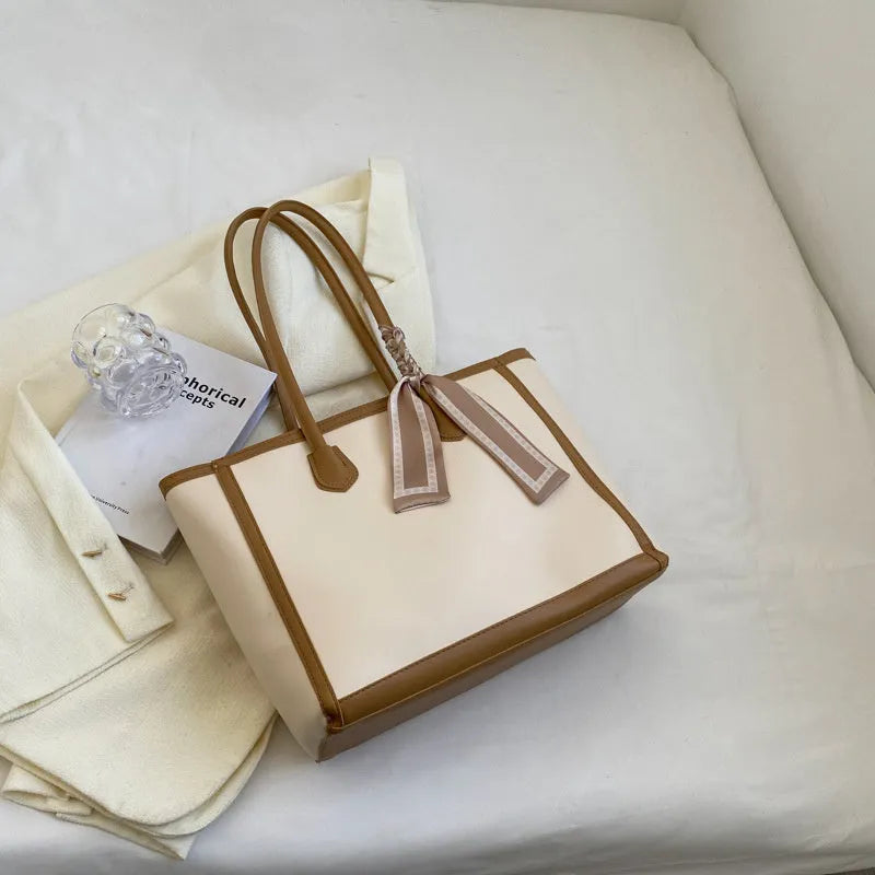 Soft PU commuter shoulder bag showing open pocket, internal phone compartment, and zippered change section