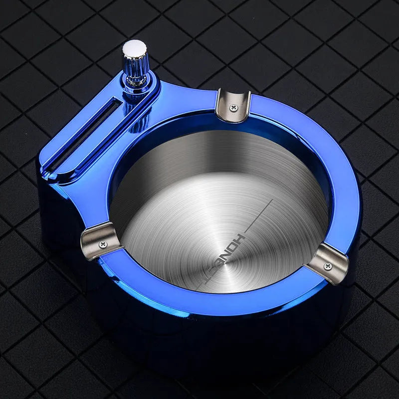 Large blue metal ashtray with integrated permanent match lighter and three cigarette slots.
