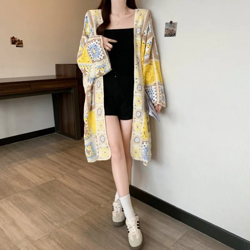 Loose crocheted hollow out sweater coat cardigan with geometric pattern in Lotus Root colour, polyester fibre, medium length 65cm