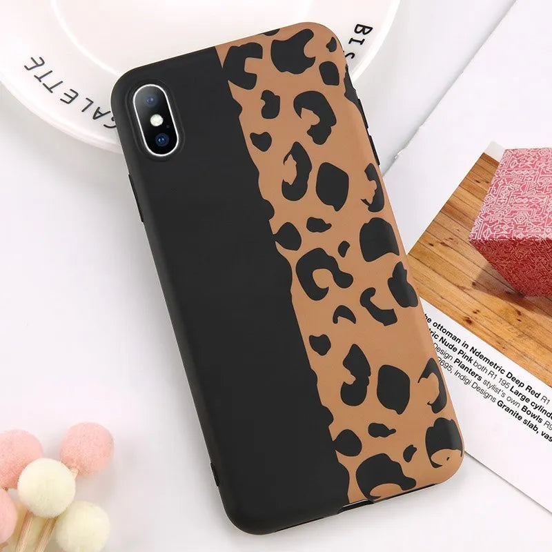 Leopard print mobile phone case for iPhone in black, blue, and pink colours