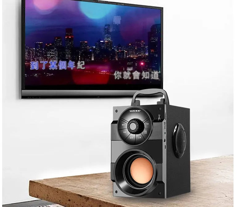 Black portable mini home audio system with subwoofer and 3.5mm audio connection cable