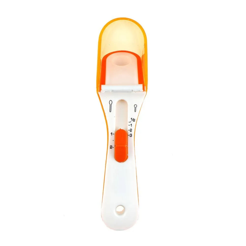 Two magnetically nested digital measuring spoons in blue and orange on a kitchen surface