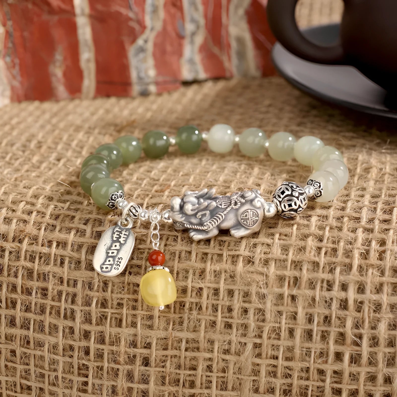 Retro women's pure silver bracelet with a Natural Hetian Jade stone and an 8mm coin charm.