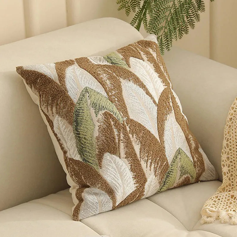 Close-up of a beige and green floral Jacquard woven cushion cover with textured pattern, 45cm square.