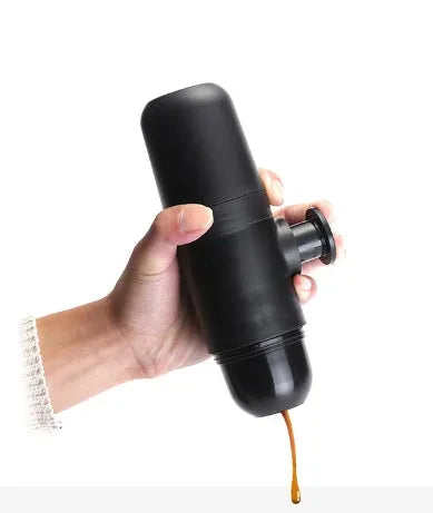 Black portable manual coffee machine measuring 6×17.5cm with stainless steel components
