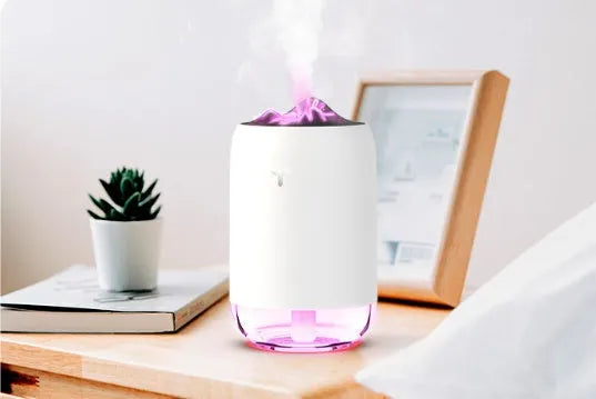 Mini cylindrical USB humidifier in green, pink, or white with 260ml water tank