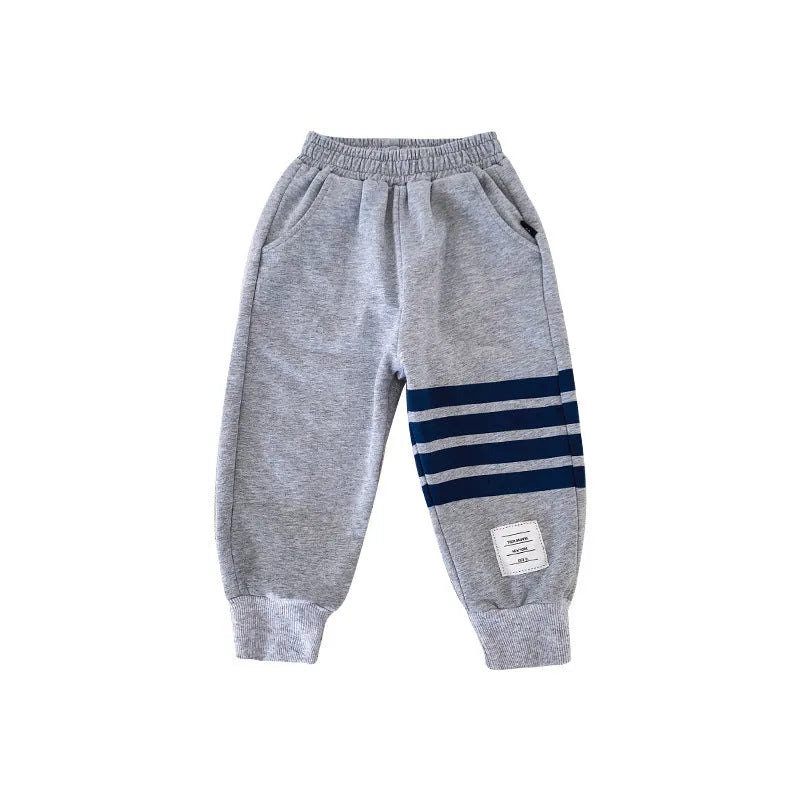 Boys' grey cotton sports trousers with elasticated waistband on child model