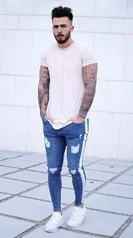 Men's ripped nostalgic light blue cotton-spandex straight leg jeans with zipper fly, front view