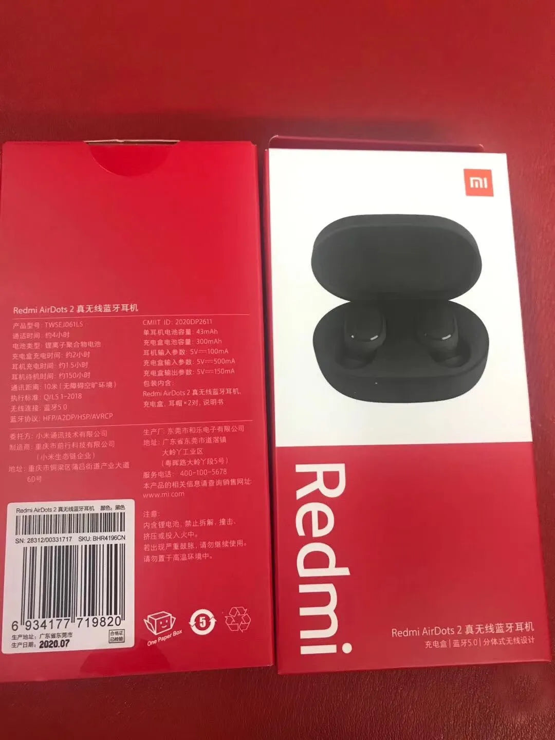 Redmi AirDots 2 black true wireless earbuds next to their compact charging case on a white background.