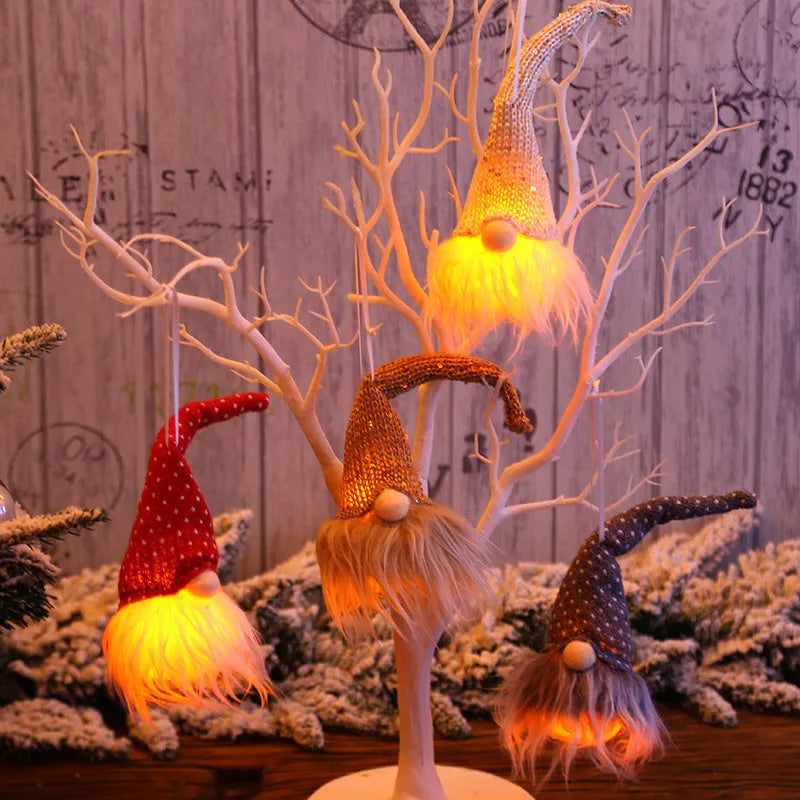 Handmade Swedish forester gnome LED tree pendant with warm light and snowflake details, 8x20 cm, beige colour