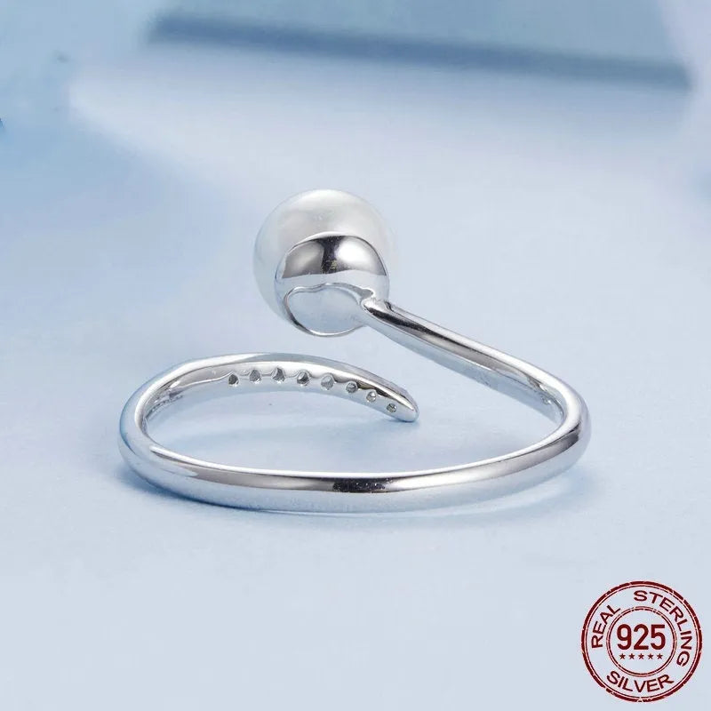 S925 sterling silver adjustable open loop ring with a natural shell pearl.