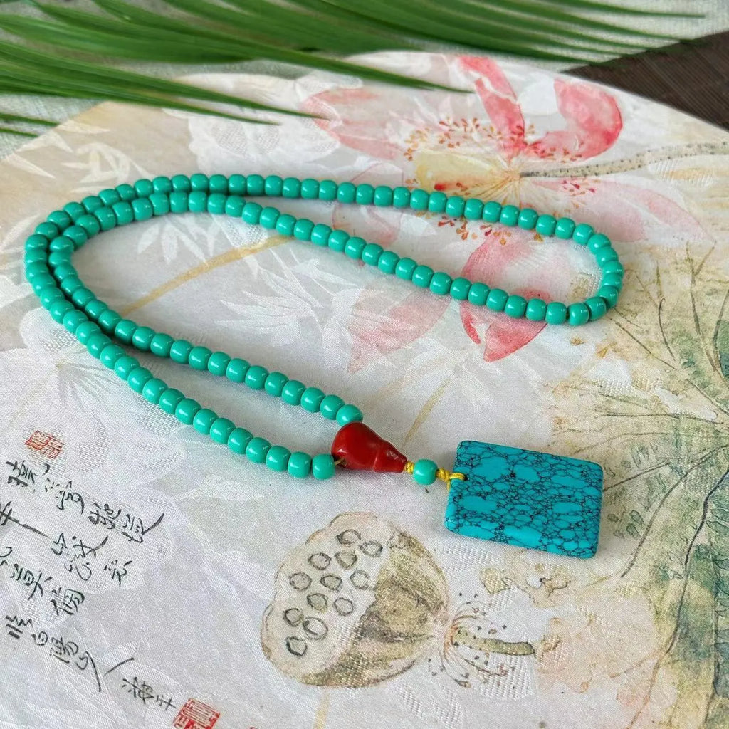 Turquoise stone mesh flower pendant necklace with adjustable ball bead chain