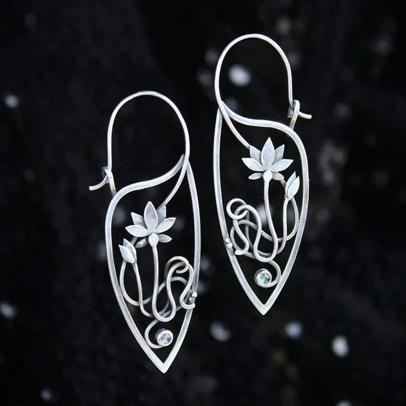 Silver women's earrings with lotus vine design featuring geometric floral patterns and circular rhinestones