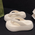Women's thick-soled height increasing EVA flip-flops with herringbone strap in solid black