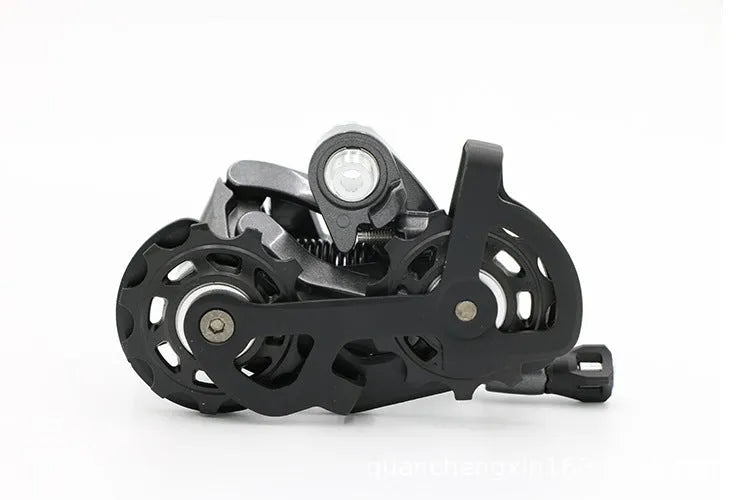 Aluminium road bike transmission kit showing hand change dial, front dial, short leg rear derailleur, chain, and decorative beads.