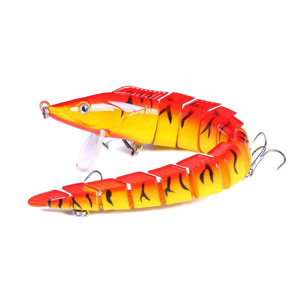 Multi-segment soft fishing lure mimicking a loach, shown in a realistic colour pattern with a visible hook.