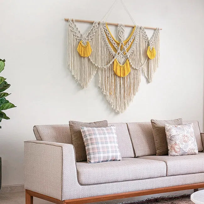 Hand-woven creamy-white cotton Nordic tapestry with yellow accents, 120cm by 95cm rectangular wall hanging.