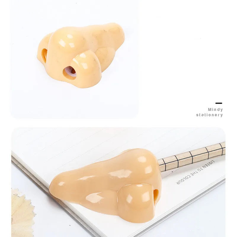 Flesh coloured plastic manual pencil sharpener with geometry shape and large nostril opening