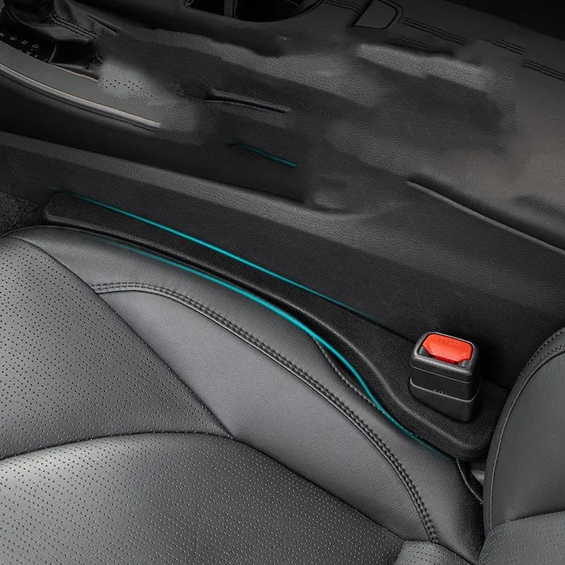 Two polyresin car seat gap sealing strips in chosen colour, showing integrated handle.