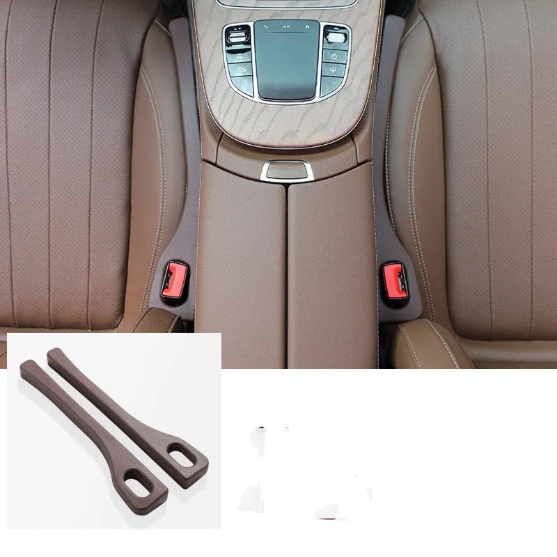 Two polyresin car seat gap sealing strips in chosen colour, showing integrated handle.