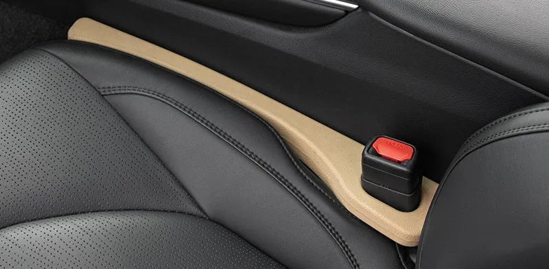 Two polyresin car seat gap sealing strips in chosen colour, showing integrated handle.