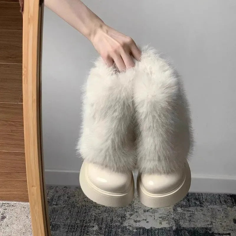 Women's black fleece-lined low-top snow boots with a waterproof rubber platform sole on a white background.