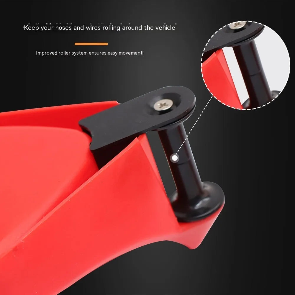 Set of four bright red triangular plastic parking wheel chocks on a grey background