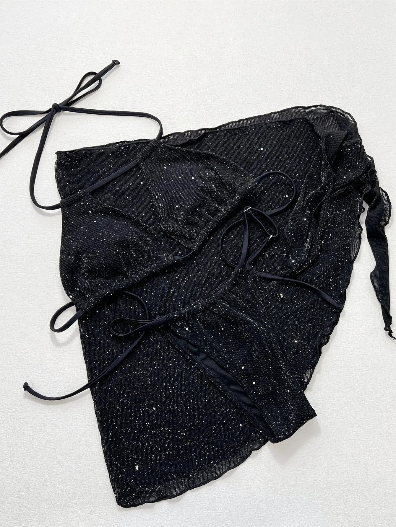 Black three-piece swimsuit bikini set with high-waisted shorts on mannequin