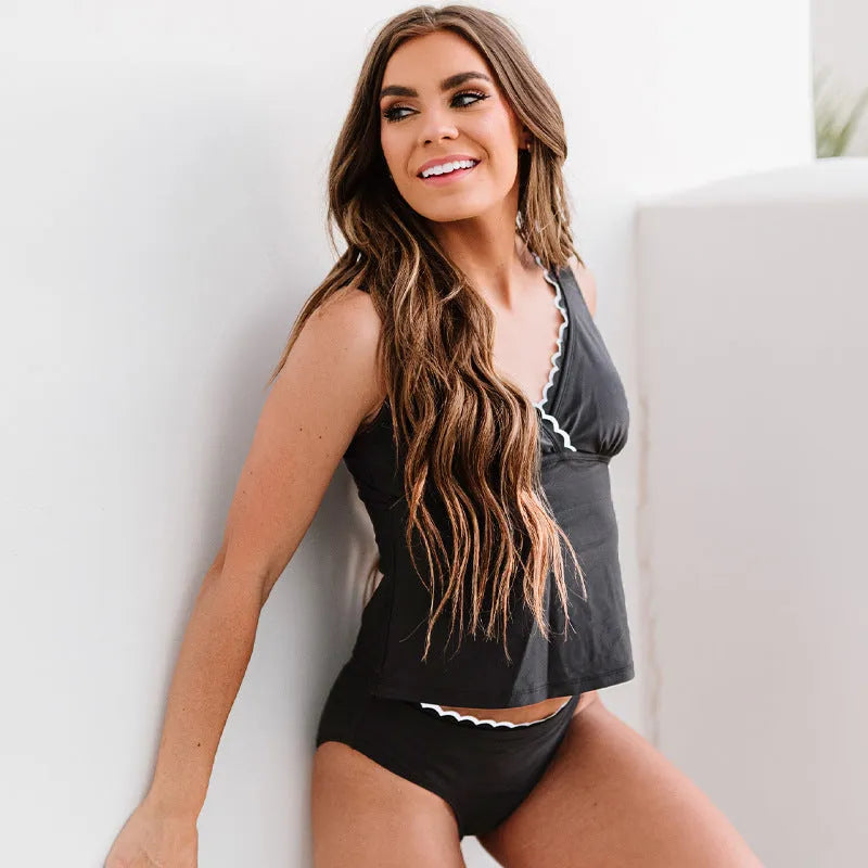 Black women's swimsuit with split-style design on mannequin