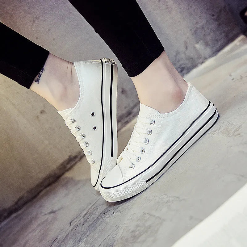 Women's solid colour canvas casual shoes shown in black, white black, white red, and all black options.