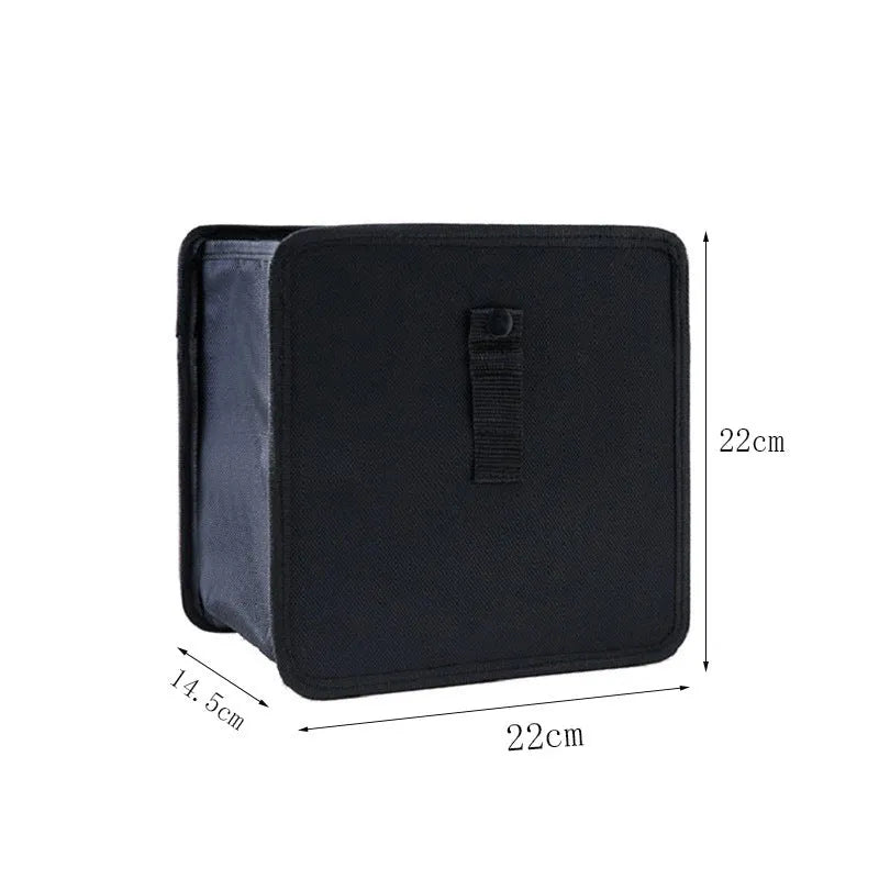 Black car folding trash can made from waterproof Oxford cloth, shown hanging