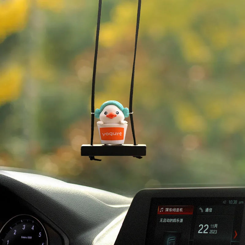 Yellow plastic duck doll car hanging ornament showing four style options: bath towel, swimming ring, bath bucket, and bow.