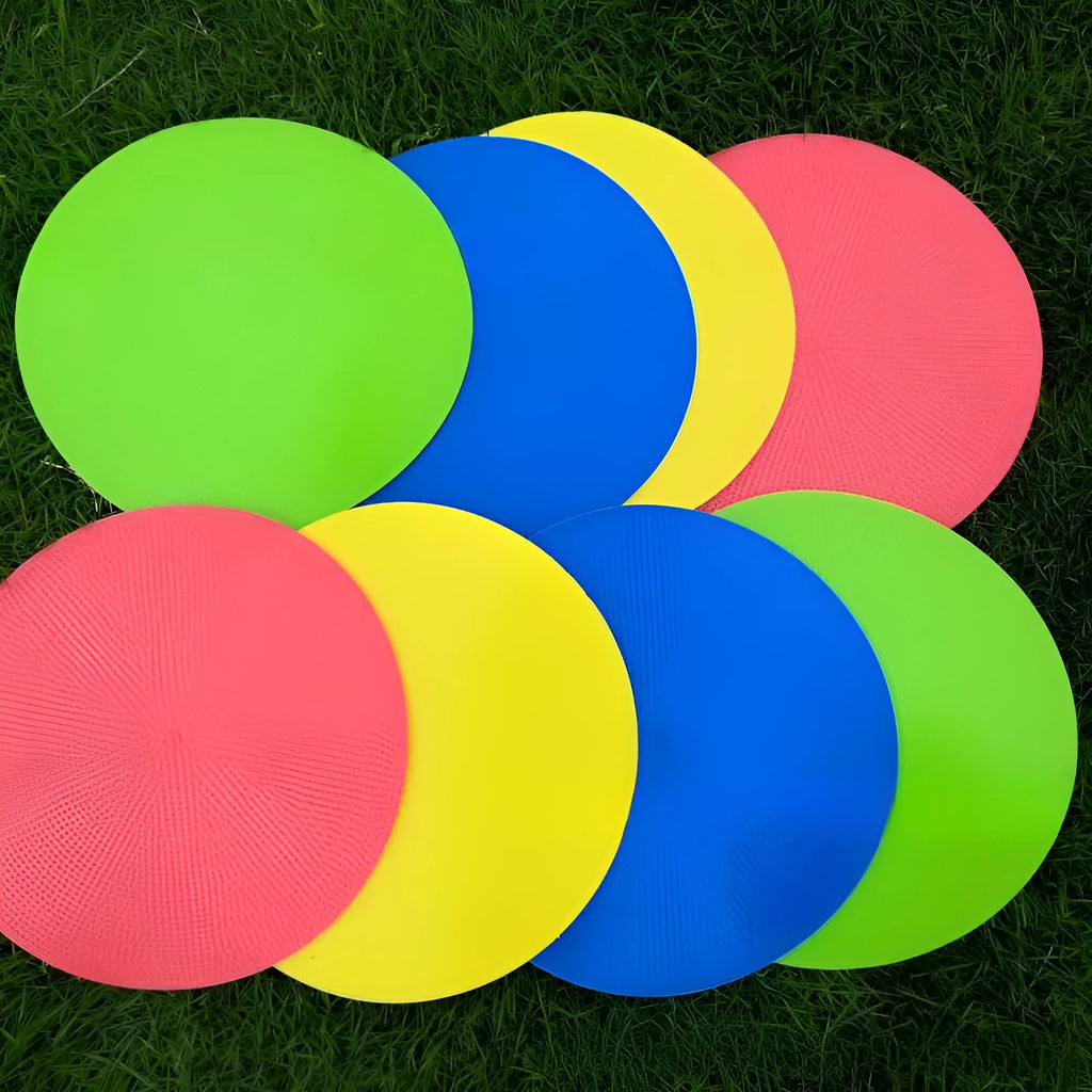 23cm diameter football training landmark pad in bright colours on grass field