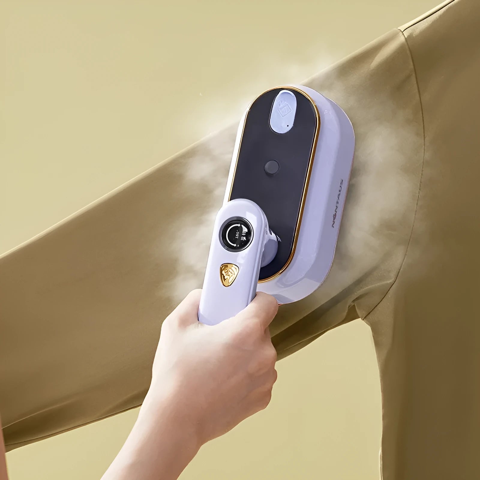 Light purple foldable travel iron with ceramic soleplate and mechanical controls for worldwide voltage use