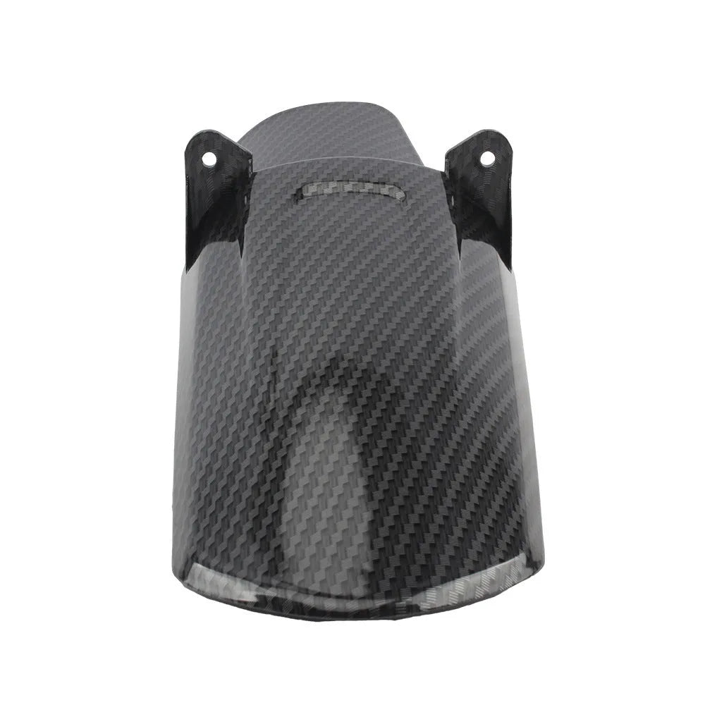 Carbon fibre rear shock absorber fender for a scrambling motorcycle.