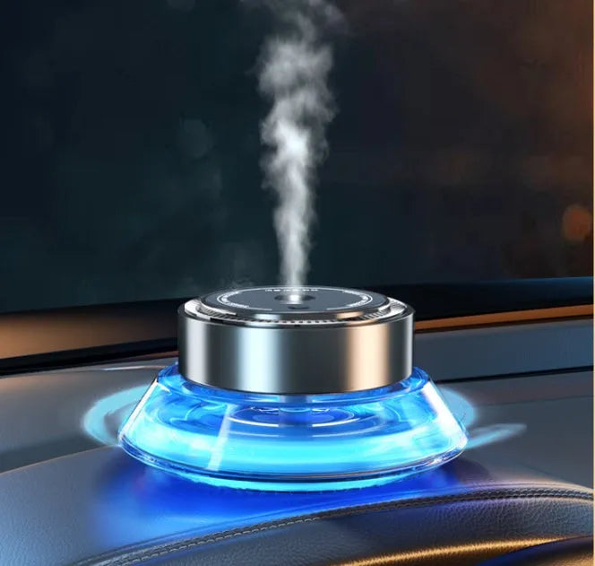Smart spray car air freshener unit in Gentleman's Black or Qian Shan Cui colours with Ocean and Gulong fragrance refill bottles