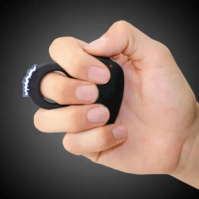 Black alloy cheetah design electric shock ring toy with fingerstall on hand