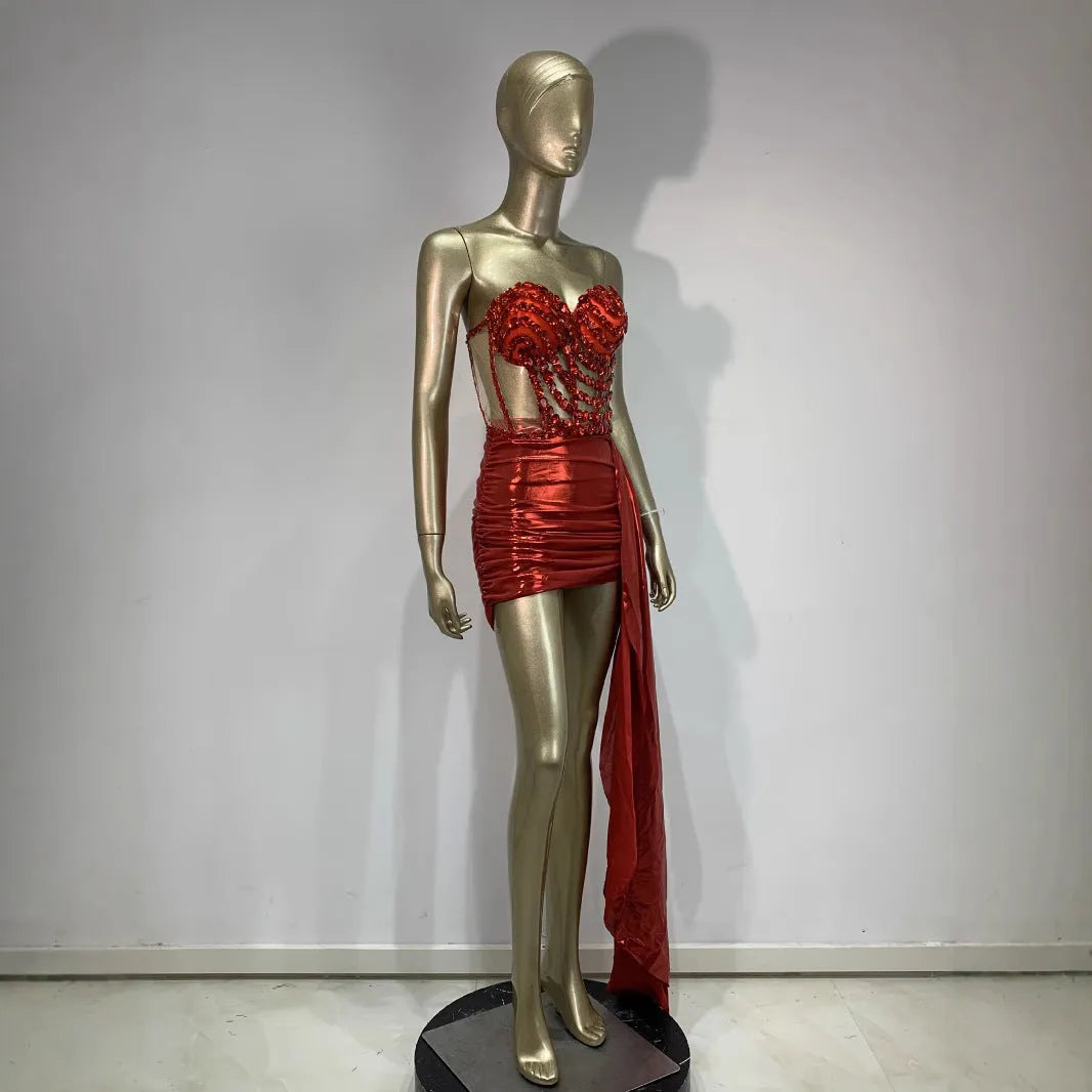 Red female skirt suit with hollow mesh see-through panels, a stage and party costume made from spandex.