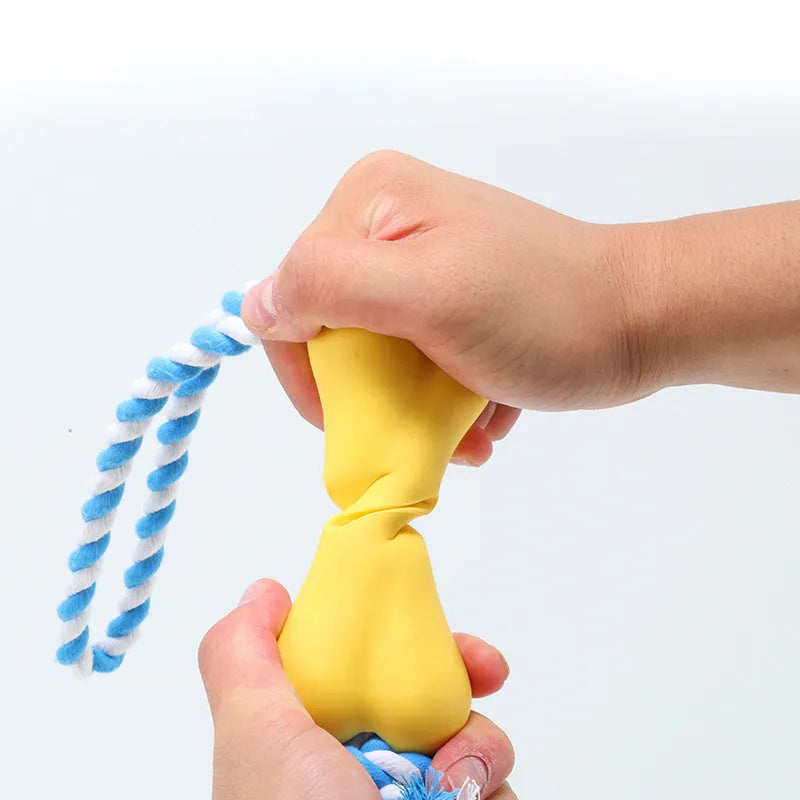 Green porous bone-shaped dog toy with rope knot texture and slots for beef strips or cheese treats