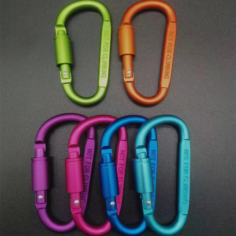 Silver D-shaped aluminium locking carabiner with an 8cm profile on a grey background.