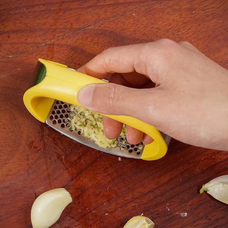 Stainless steel garlic masher press with ergonomic handle and non-slip grip