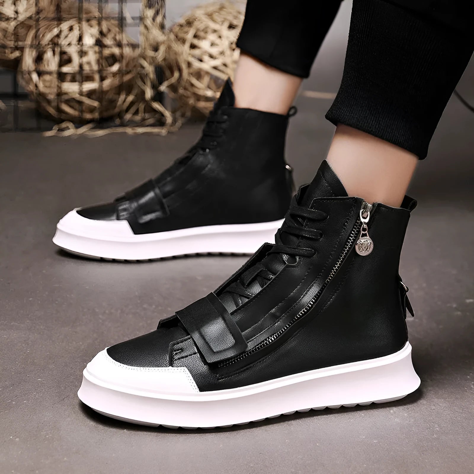 Black and white PU leather men's ankle boots with high-top sneaker design showing microfiber material texture