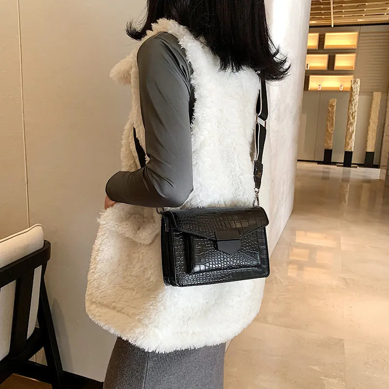 Vintage PU leather crossbody bag in black, shown with a mobile phone and wallet inside